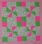 Green pink pinwheel paper quilt by Rona